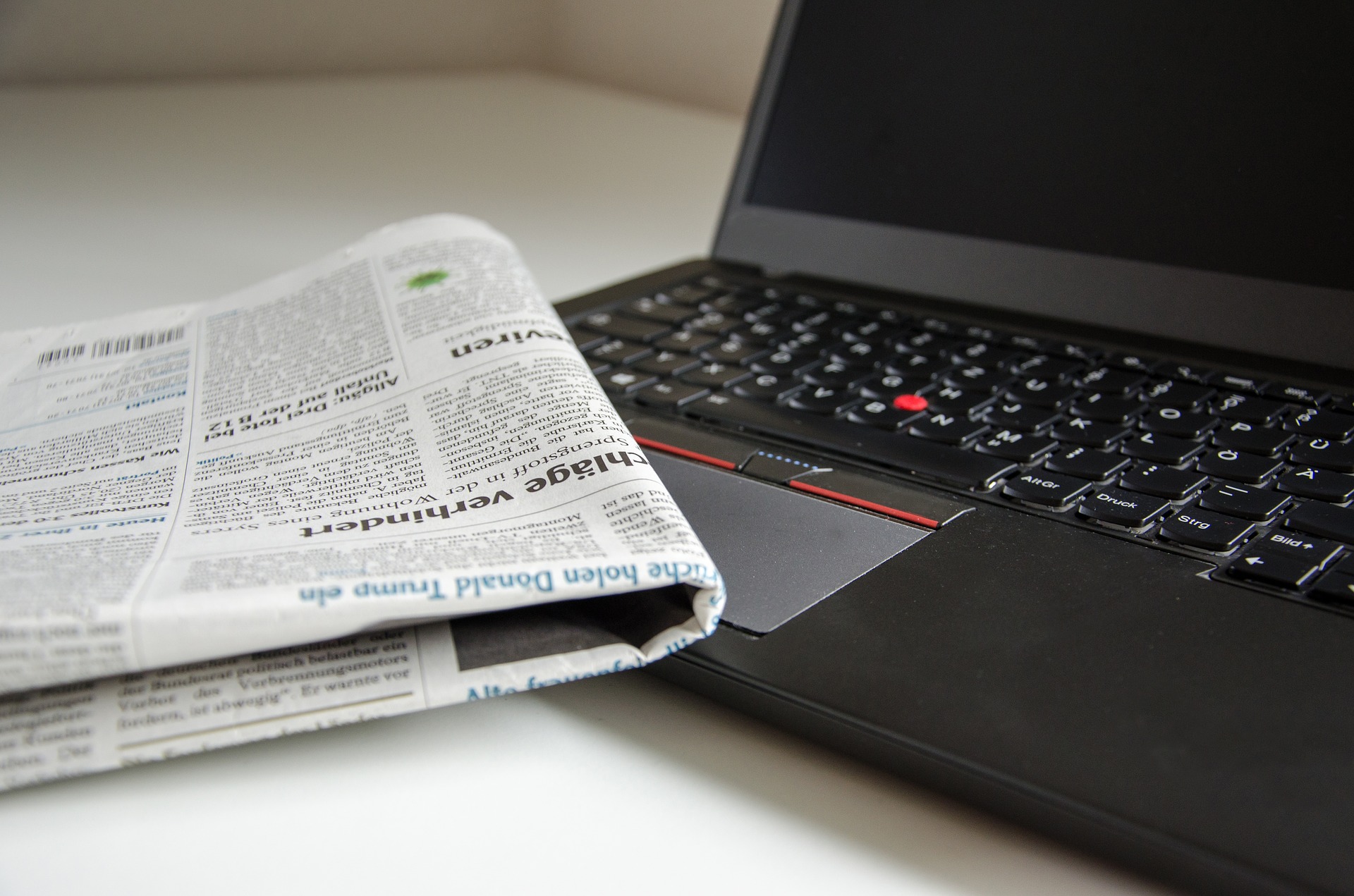 Newspaper on top of laptop keyboard